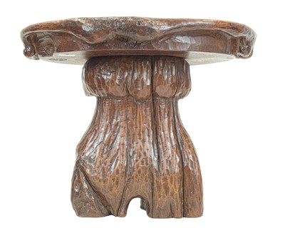 Lot 42 - A small carved oak stool.