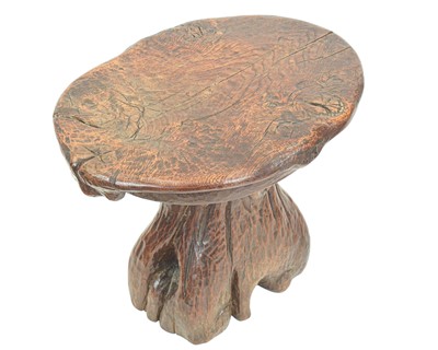 Lot 42 - A small carved oak stool.