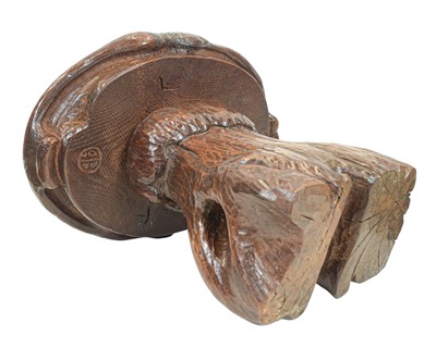 Lot 42 - A small carved oak stool.