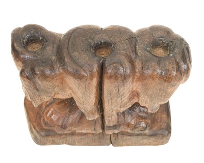 Lot 40 - A carved oak candelabrum.