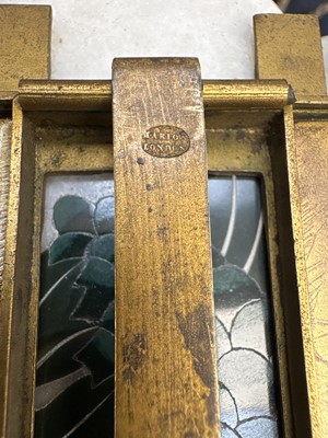 Lot 23 - A gilt metal double photograph frame.