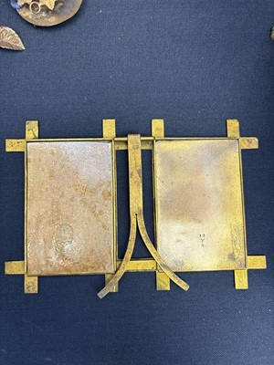 Lot 23 - A gilt metal double photograph frame.