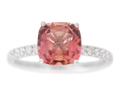 Lot 107 - An 18k white gold ring set with a cushion-cut pink tourmaline.