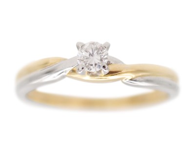 Lot 111 - A 14k white and yellow gold diamond solitaire ring.
