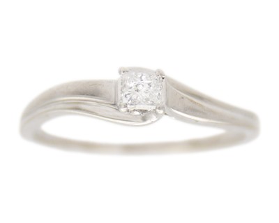 Lot 115 - A 9k white gold princess-cut diamond solitaire ring.