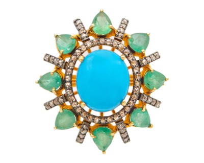 Lot 120 - An impressive silver-gilt ring set with an oval cabochon turquoise and pear-shaped emeralds.
