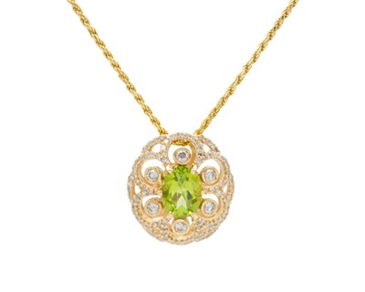Lot 81 - A vintage-styled 14k yellow gold pendant set with an oval peridot.