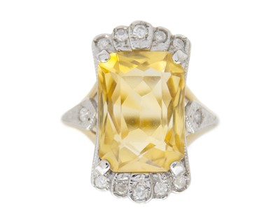 Lot 157 - A 9k yellow and white gold citrine and diamond dress ring.