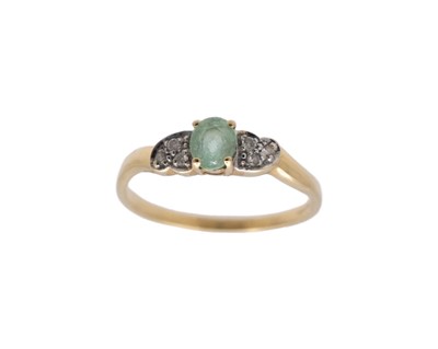 Lot 175 - A modern 18k oval green tourmaline and diamond set ring.