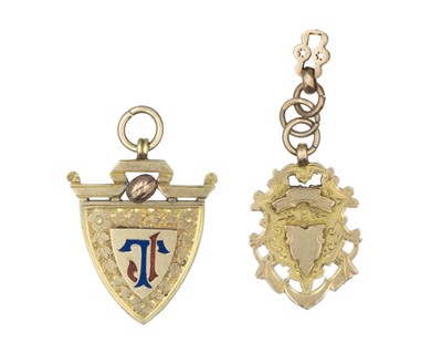 Lot 583 - Two hallmarked 9k gold armorial crest fobs.