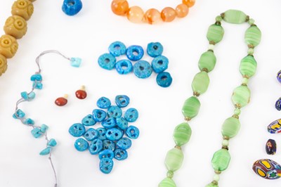 Lot 201 - A selection of Persian faience donkey beads.