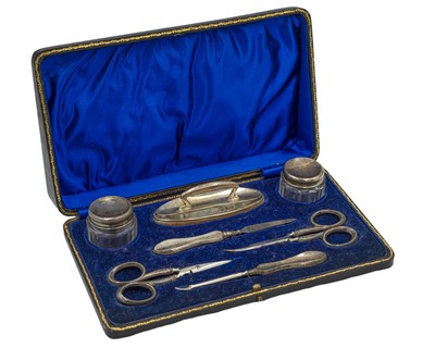 Lot 78 - A George V silver handled manicure set by W J Myatt & Co.