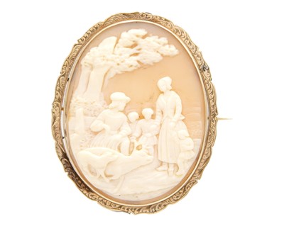Lot 166 - A 9k-mounted oval shell cameo brooch depicting a bucolic scene.
