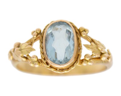 Lot 158 - An Arts & Crafts 14k (tested) gold oval cut aquamarine ring.