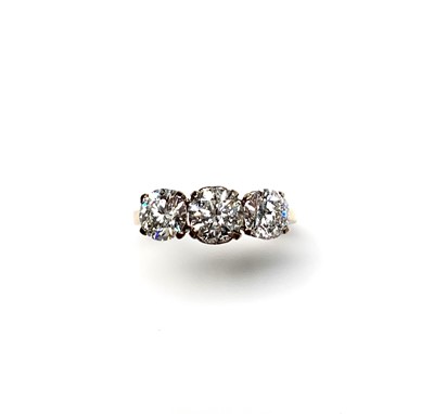 Lot 2342 - A good three stone diamond ring totaling...