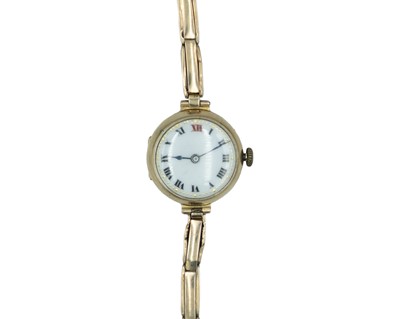 Lot 713 - An early 20th century 9k cased lady's manual wind wristwatch with 9k expanding bracelet.