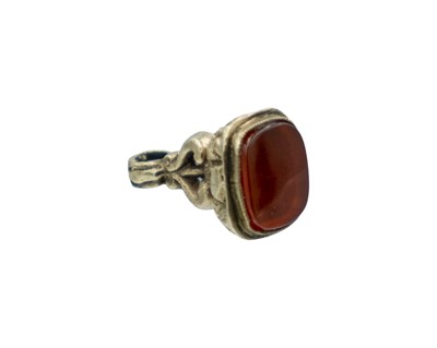 Lot 562 - A 9k small watch fob with carnelian seal.