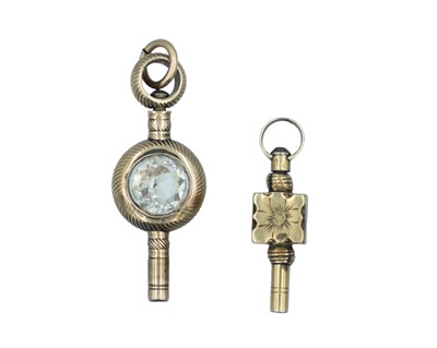 Lot 555 - Two 19th-century gold fancy watch winder keys.