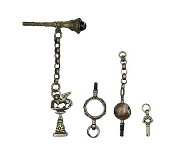 Lot 589 - A 19th-century small gold watch winder, three gold-plated winders, a silver fob, & two gold chains.