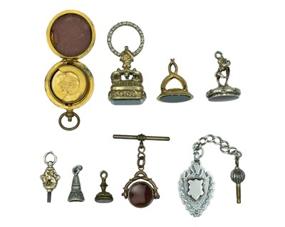 Lot 577 - A selection of pocket watch fob accessories.