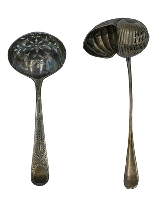 Lot 142 - A silver nautilus shell-shaped tea strainer by George Bowen & Sons.