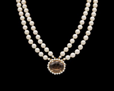 Lot 208 - A two-strand cultured pearl necklace, strung to a 9k rose gold brown topaz and pearl cluster fitting.