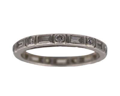 Lot 203 - An Art Deco platinum (tested) and diamond set full eternity ring.