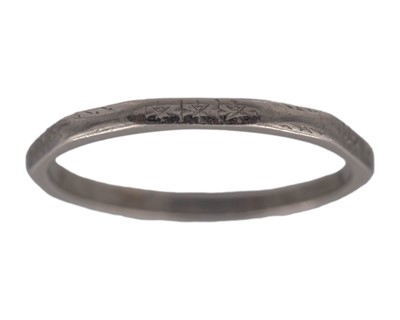 Lot 210 - A platinum band ring by Walker & Hall Ltd.