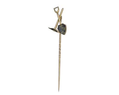 Lot 217 - A 19th-century gold prospectors' shovel and pick stick pin, with gold in matrix inset.