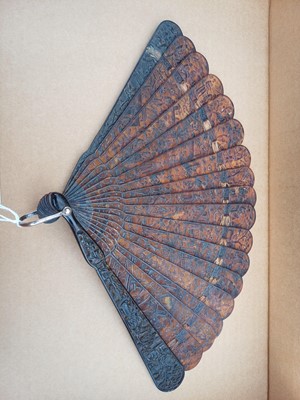 Lot 558 - A Chinese Canton carved tortoiseshell brise fan.