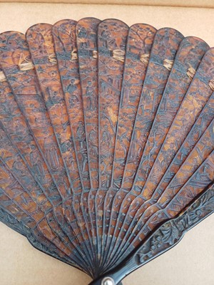 Lot 558 - A Chinese Canton carved tortoiseshell brise fan.