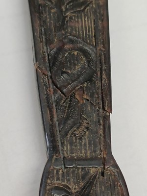 Lot 558 - A Chinese Canton carved tortoiseshell brise fan.