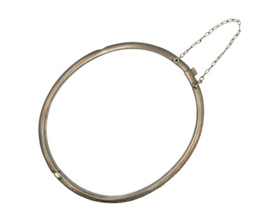 Lot 219 - A 9k rose gold (tested) hinged hollow bangle.
