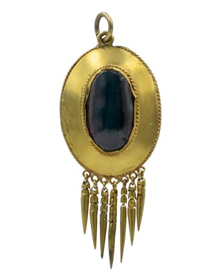 Lot 223 - A Victorian gold Etruscan Revival cabochon garnet set pendant, applied with tassels.