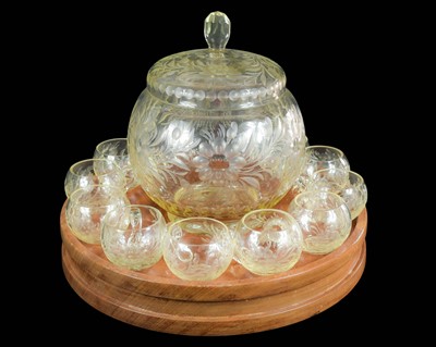 Lot 663 - A cut glass punch set on a teak Lazy Susan.