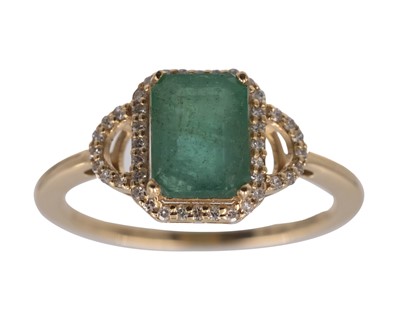 Lot 182 - A 14k yellow gold emerald-cut emerald and diamond ring.