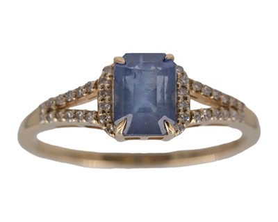 Lot 184 - A 14k yellow gold emerald-cut sapphire and diamond ring.