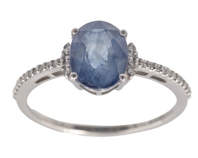 Lot 190 - A 950 platinum and oval-cut sapphire and diamond ring.