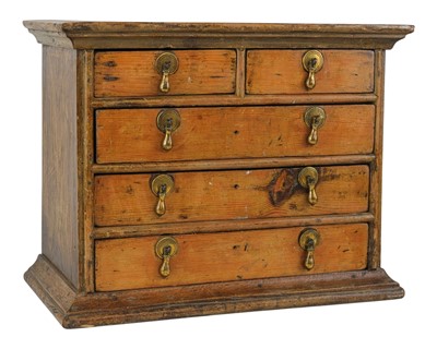 Lot 817 - A pine and oak miniature chest.