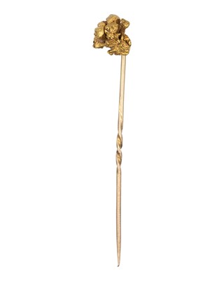 Lot 185 - A natural gold-nugget stick pin.
