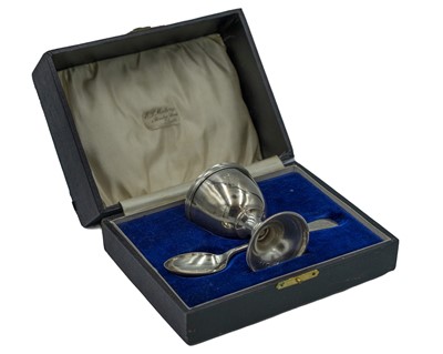 Lot 149 - A silver egg cup and spoon by Wolfsky & Co Ltd.
