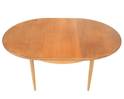 Lot 275 - A G-Plan Fresco teak extending circular dining table.