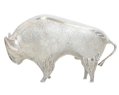 Lot 149 - A cast silver figure of a stylized bull.