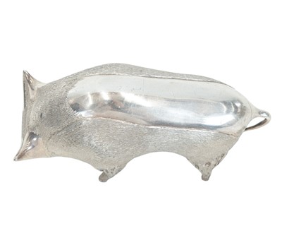 Lot 149 - A cast silver figure of a stylized bull.