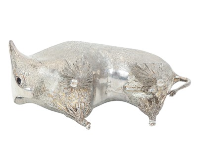 Lot 149 - A cast silver figure of a stylized bull.