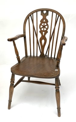 Lot 3161 - An elm and beech wheelback Windsor armchair,...