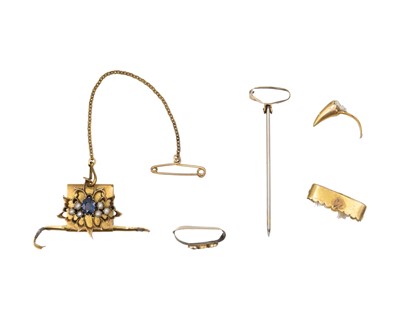 Lot 262 - A collection of scrap gold fittings from two big cat claw jewels.