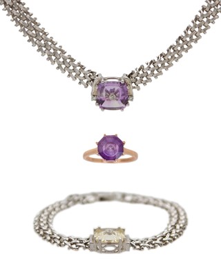 Lot 211 - GLENN LEHRER (1953-2024) -A 9k amethyst Torus ring, and a Torus silver bracelet and necklace set.
