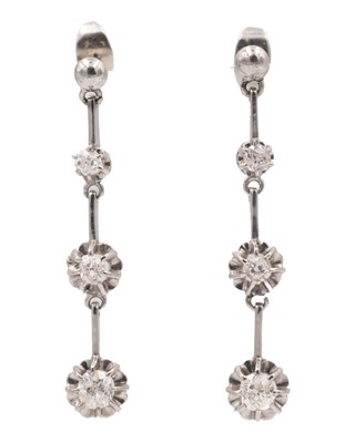 Lot 7 - An early 20th-century pair of platinum and diamond set knife-edge bar pendant earrings.
