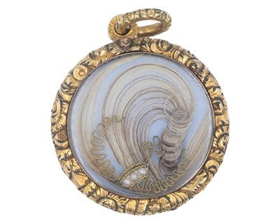 Lot 9 - A Victorian gold mourning locket pendant.